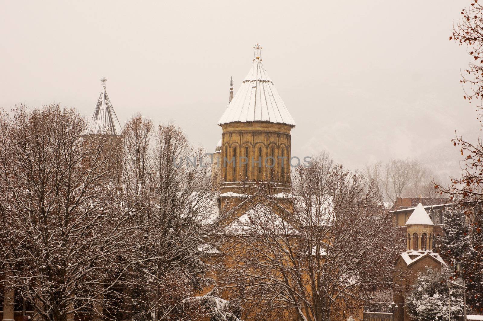 Winter view to covered with snow Tbilisi Old town in misty day by Elet