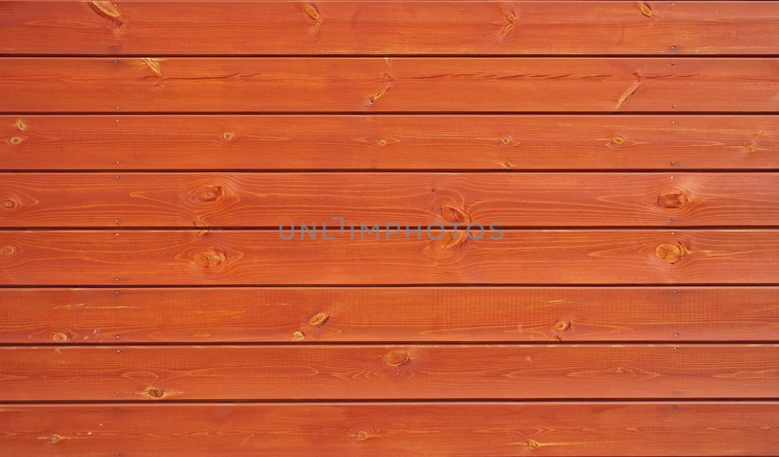 Fragment of new orange wooden boards background
