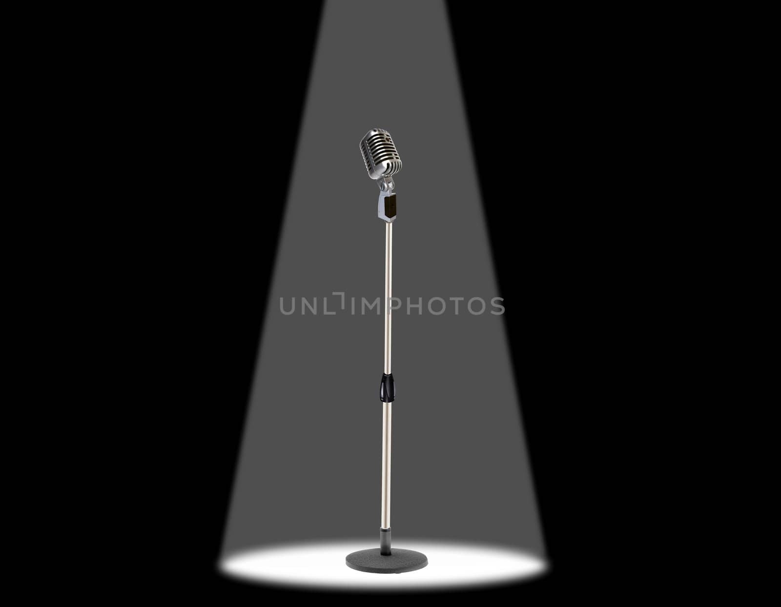 Vintage microphone under spotlight
