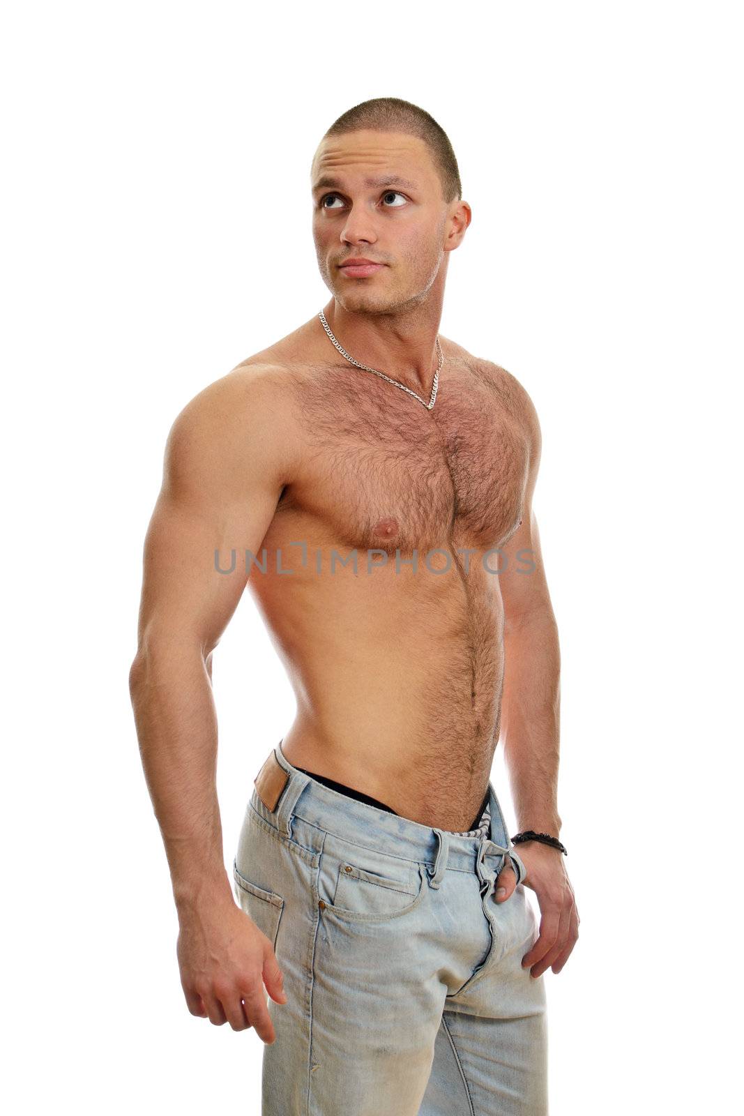 Attractive shirtless male in jeans, isolated on white