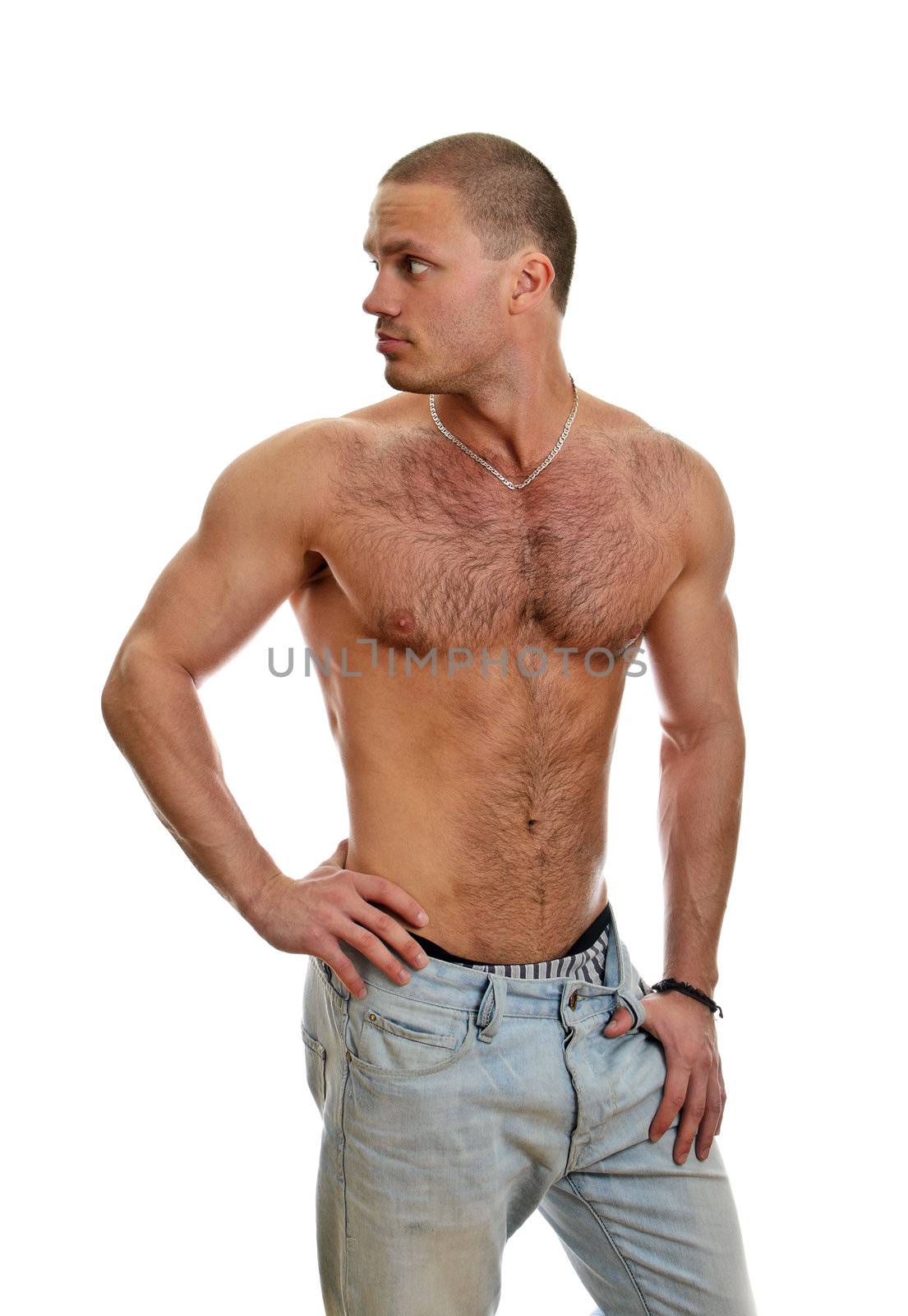 Attractive shirtless male in jeans, isolated on white