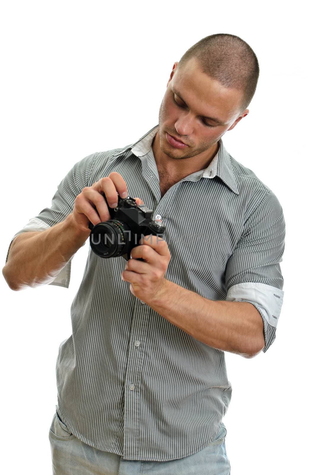 Man taking pictures with retro camera. Isolated on white.