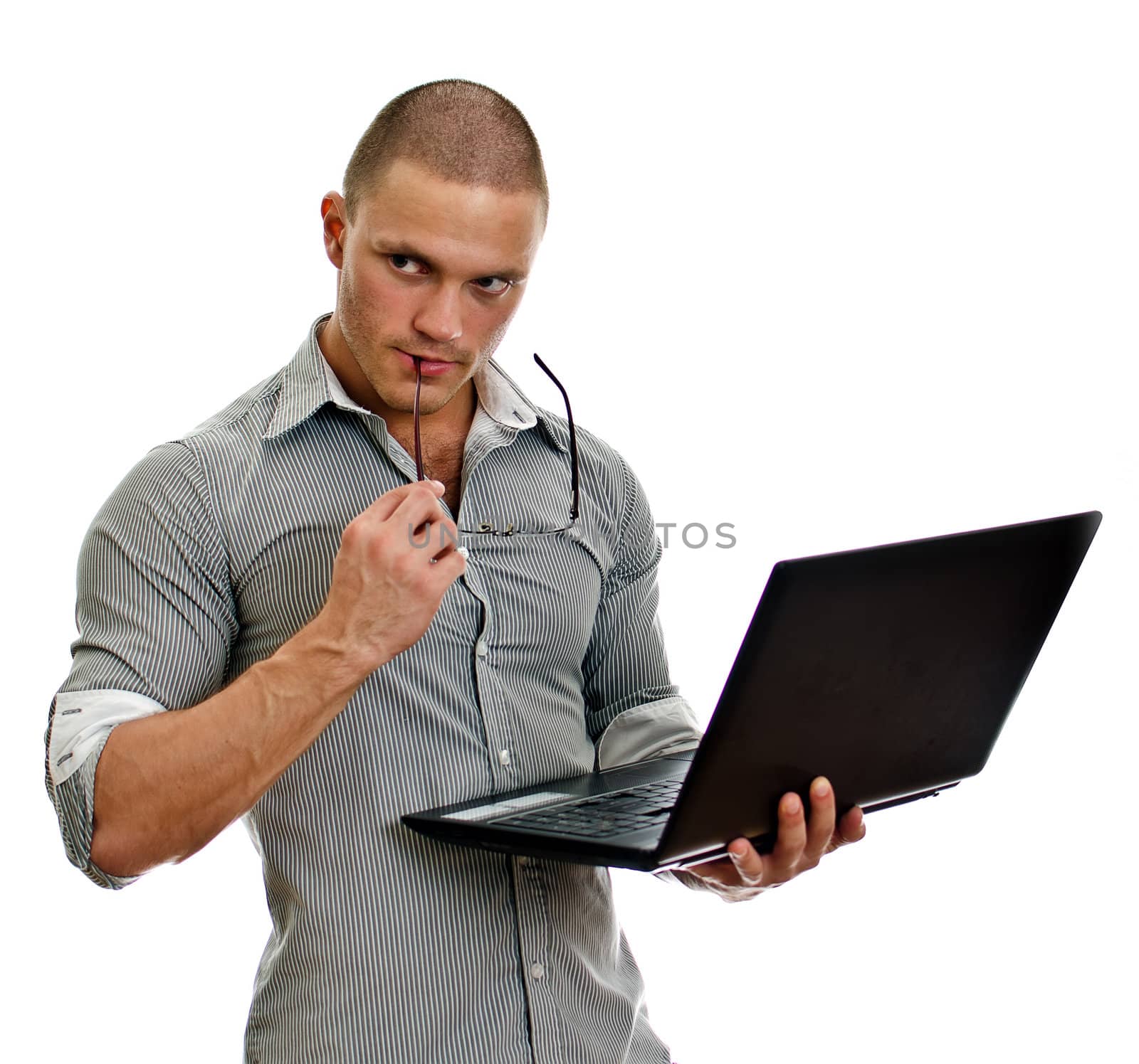 Young man wih laptop thinking. Isolated on white background.