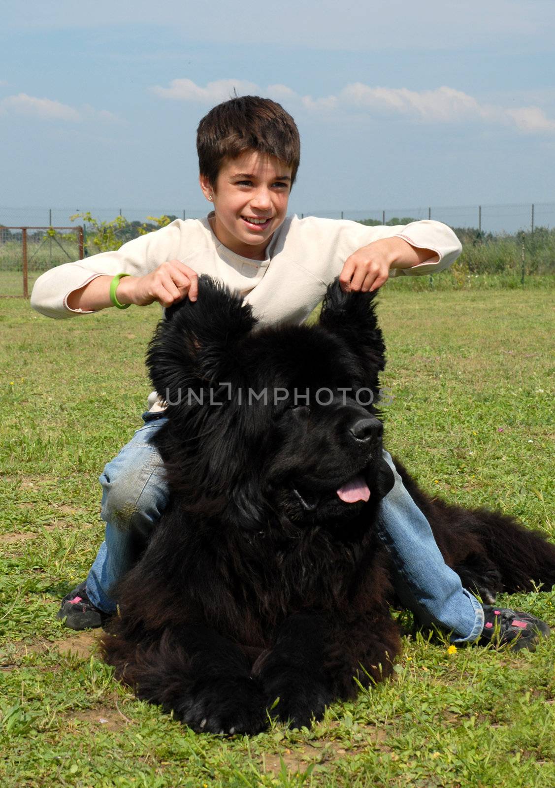 young girl and her best friend neawfoundland dog