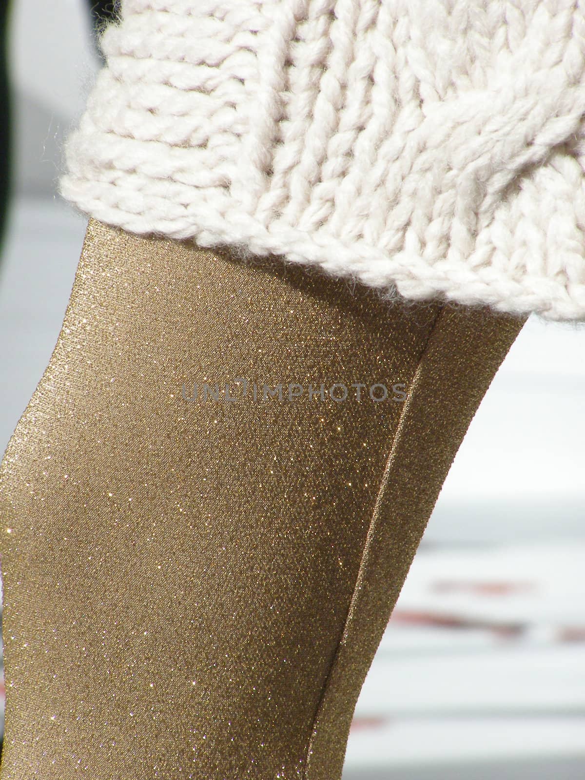 woman winter fashion: wool skirt and opaque stockings on a mannequin dummy