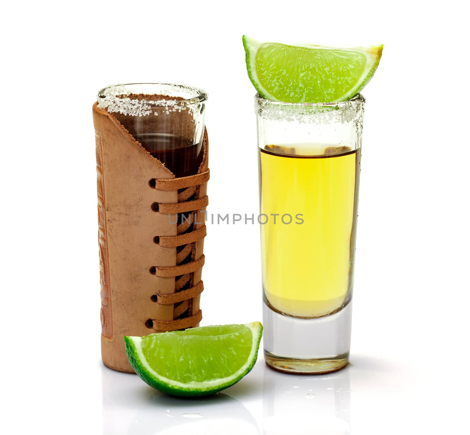 Shot of Gold Tequila with Slice Lime on white background