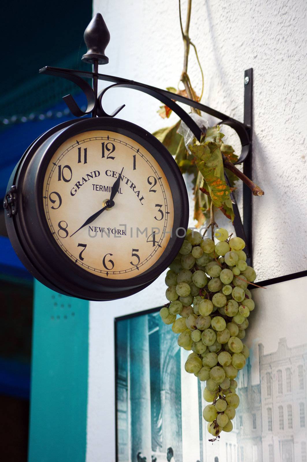 clock of grand central station NY with grape branch