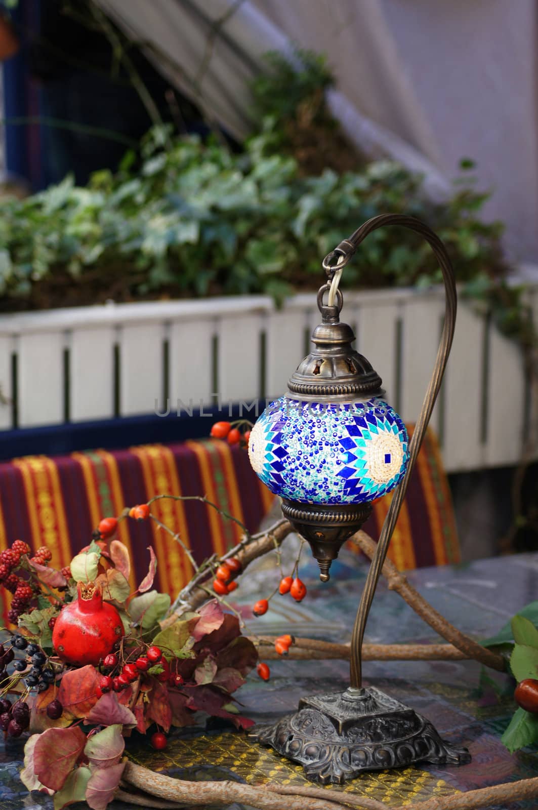 Closeup of mosaic lamp in arabic style with autumn fruits and vegetables