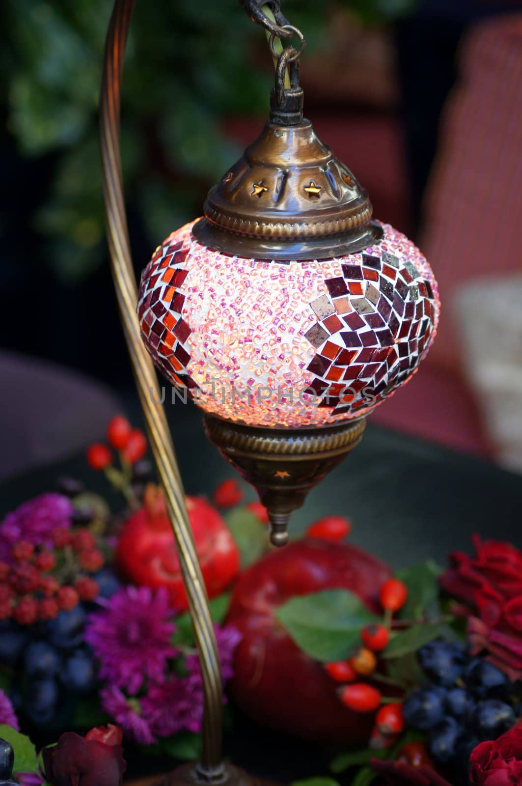 Closeup of mosaic lamp in arabic style with autumn fruits and vegetables by Elet