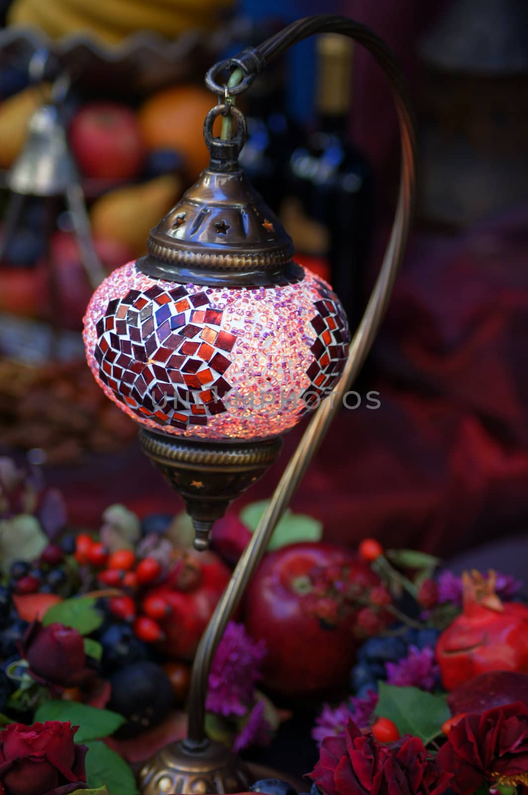 Closeup of mosaic lamp in arabic style with autumn fruits and vegetables