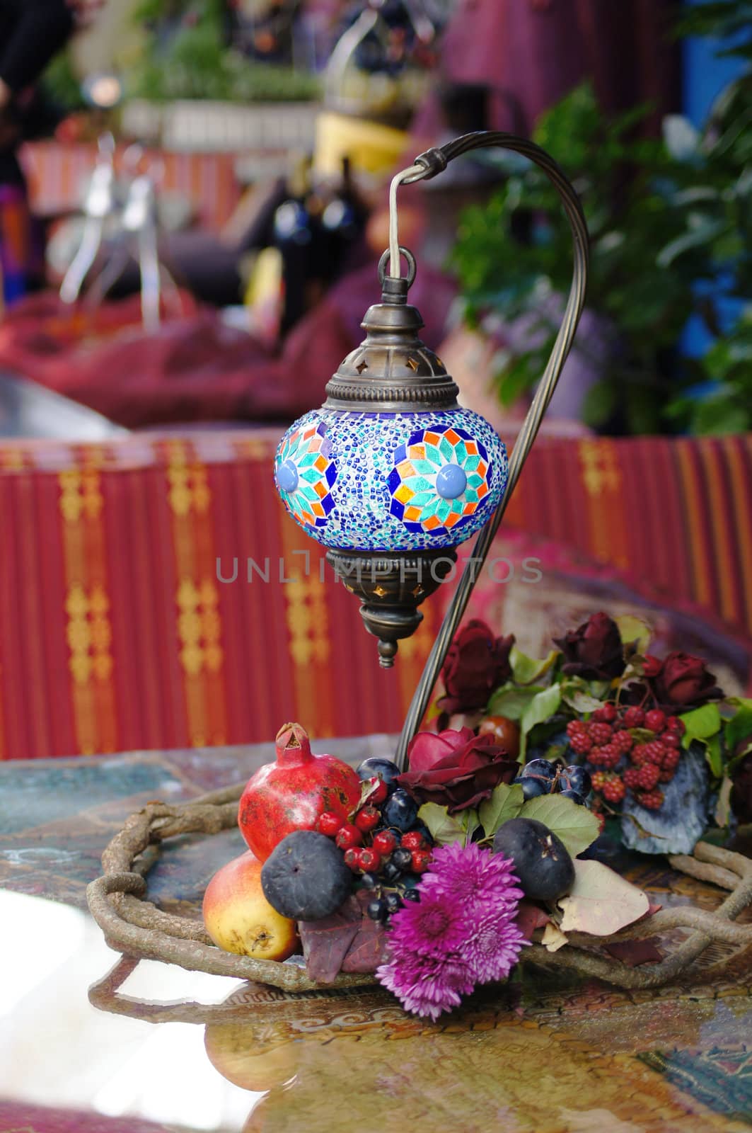 Closeup of mosaic lamp in arabic style with autumn fruits and vegetables