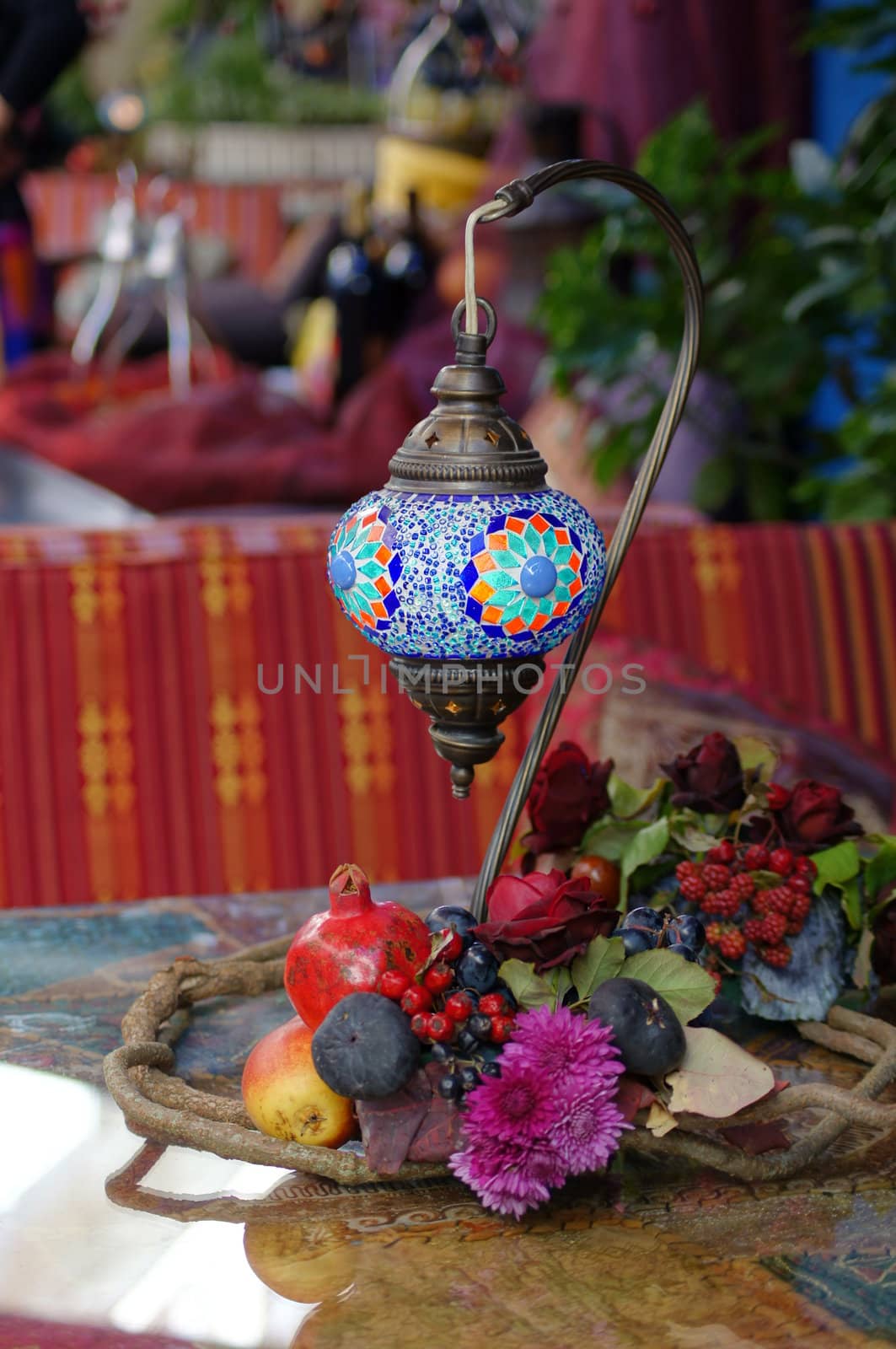 Closeup of mosaic lamp in arabic style with autumn fruits and vegetables