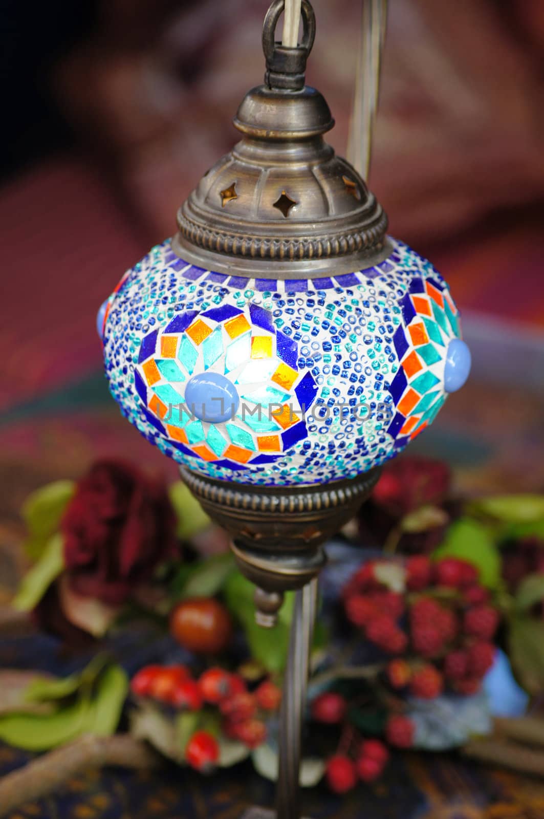 Closeup of mosaic lamp in arabic style with autumn fruits and vegetables