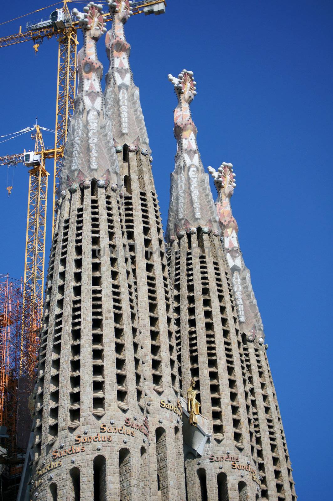 Sagrada Familia cathedral towers and blue sky         