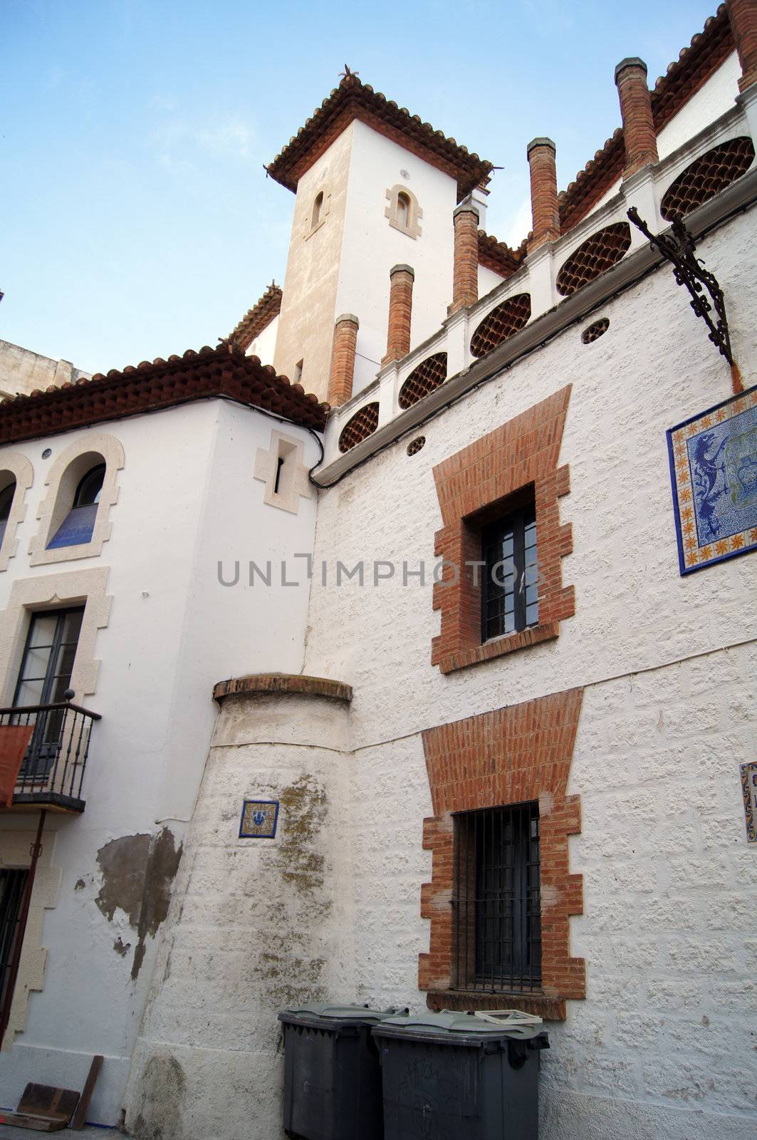 Narrow medieval street in Old Sigest town, historical resort-city close to Barcelona city, Spain by Elet