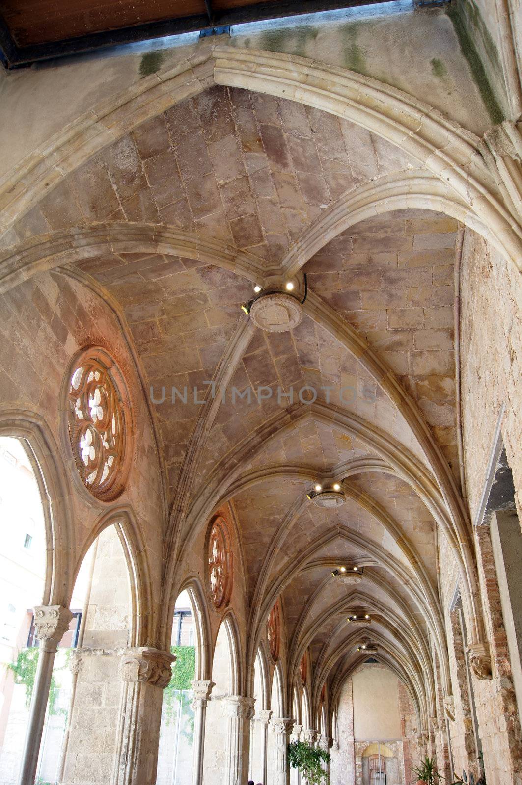 arches in interior of a gothic church in Barcelona, Spain by Elet