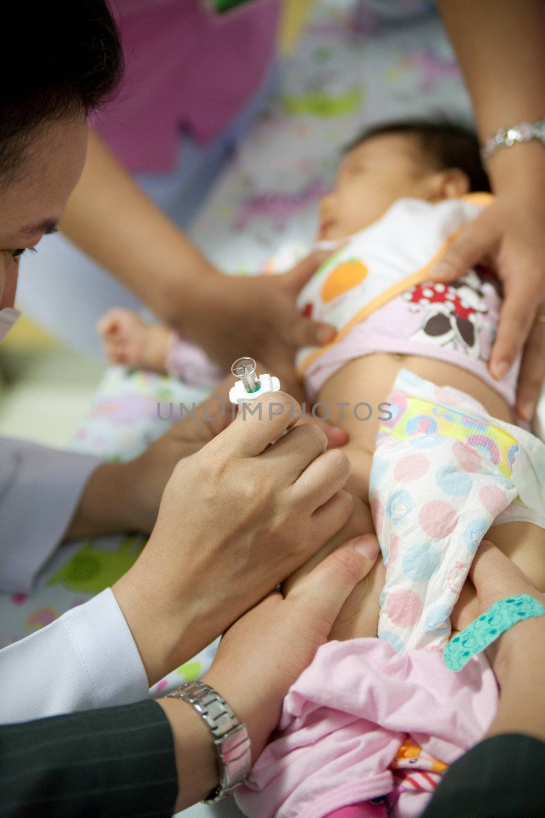 November4,2011:Doctor use a baby syringe.