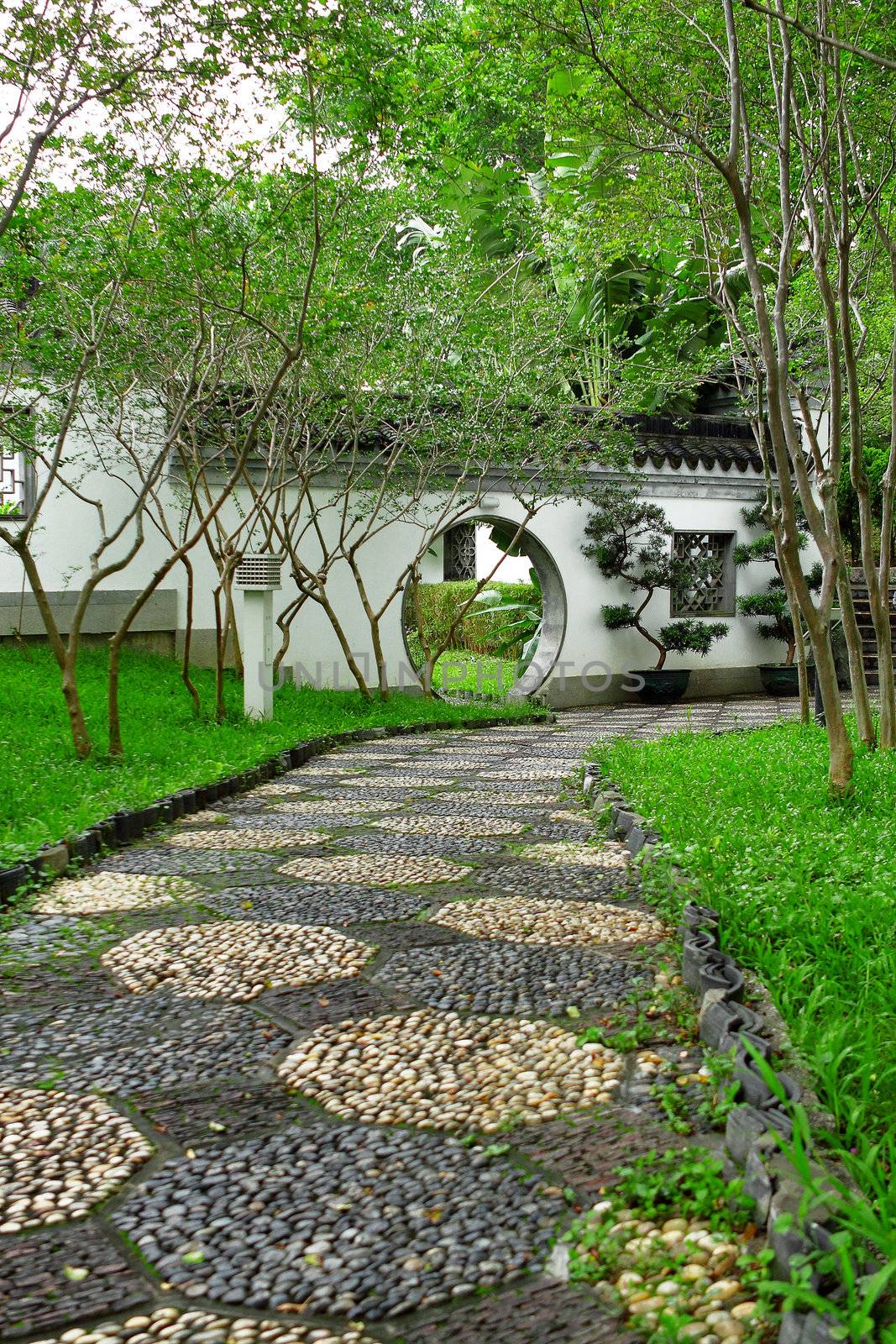 Circle entrance of Chinese garden in Hong Kong  by cozyta