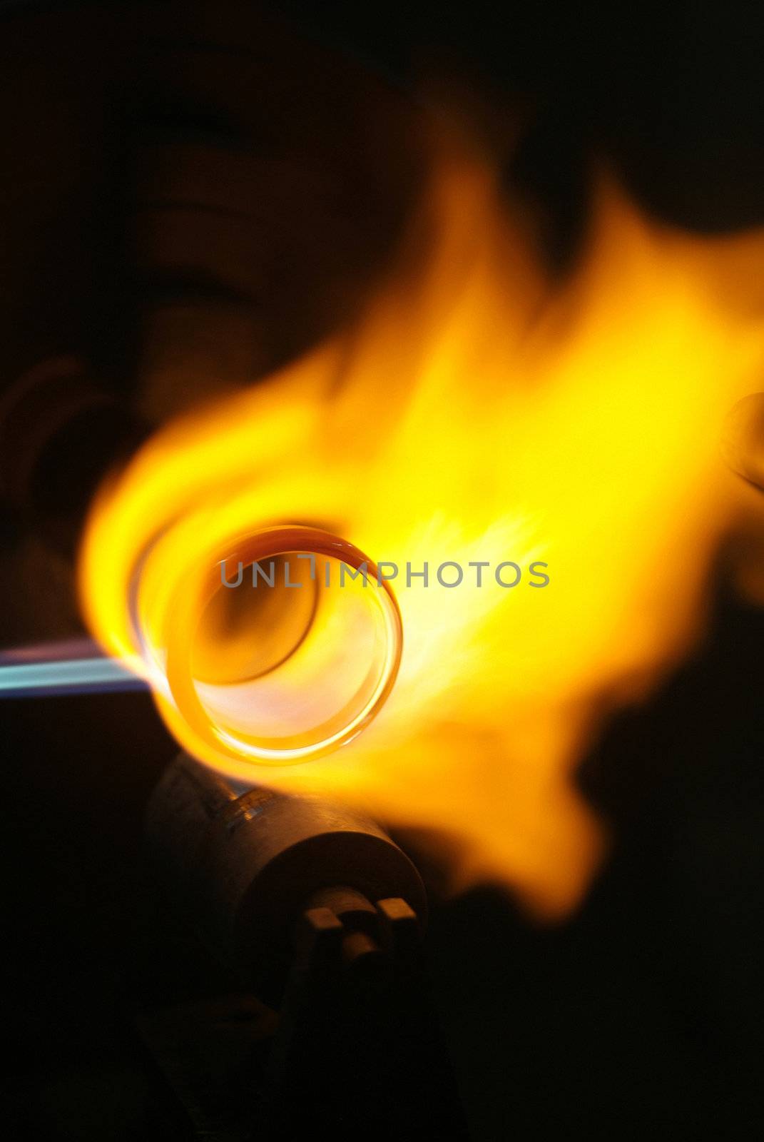 Chemical glassware with fire background by heinteh