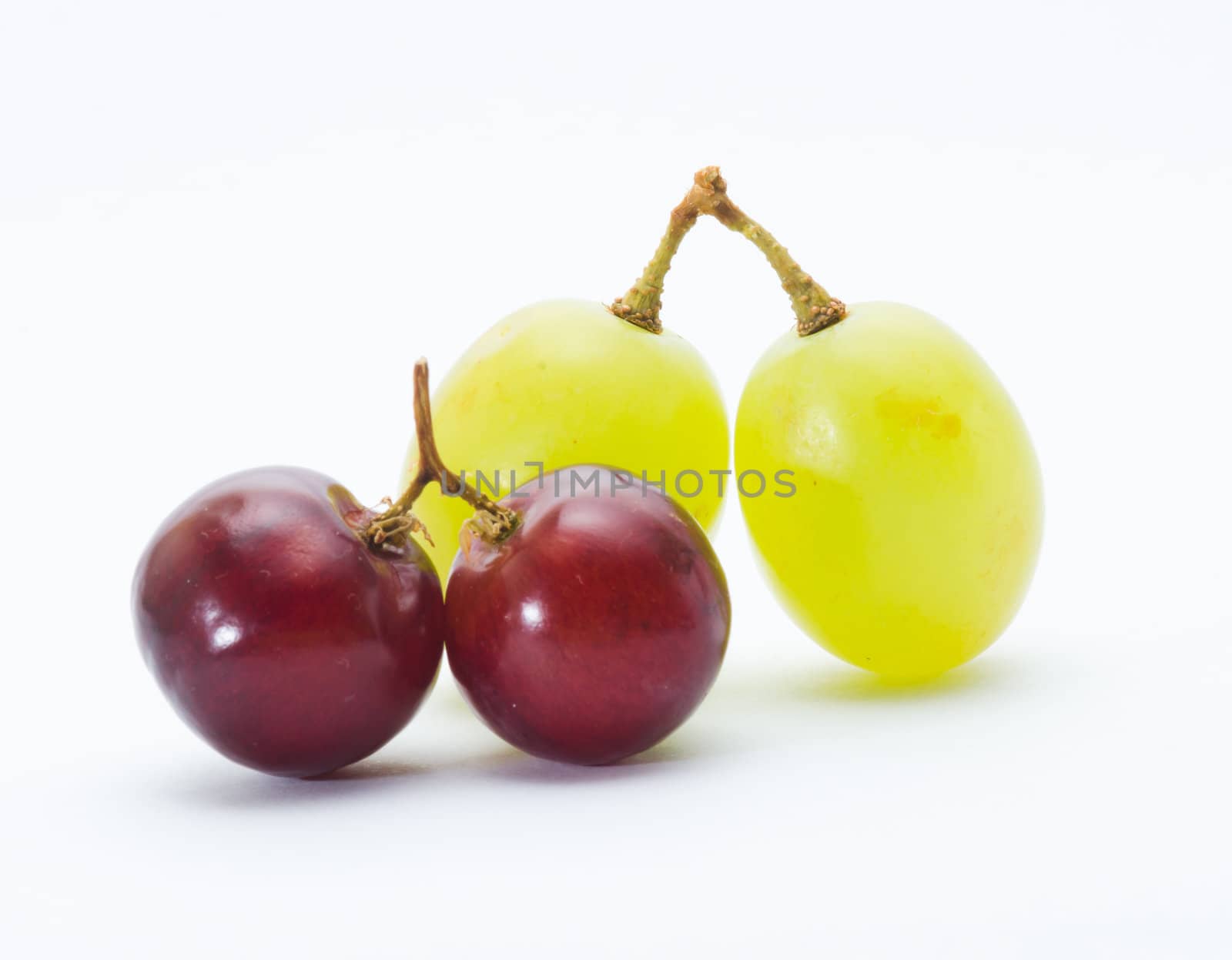 red and green grapes isolated on white