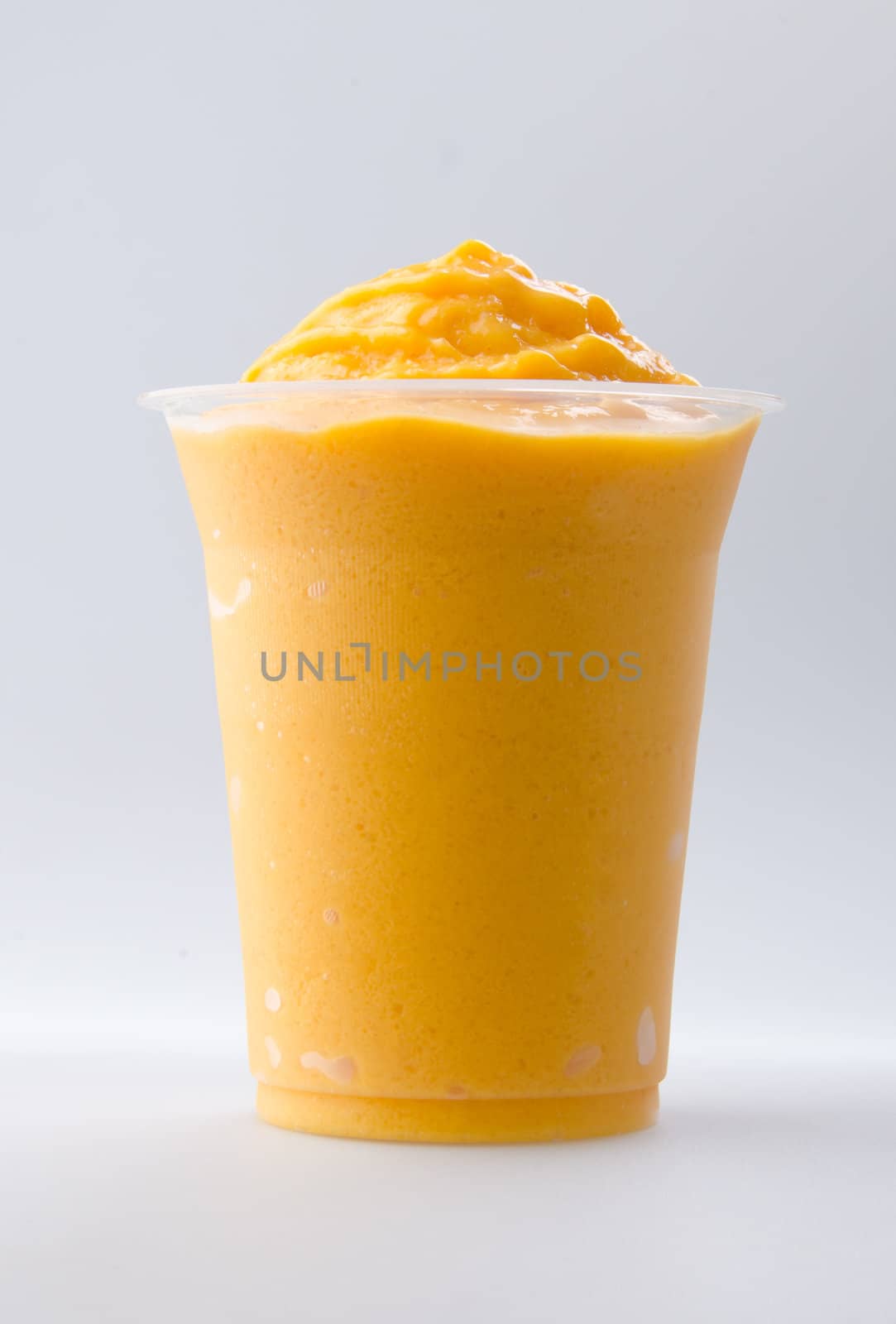 mango yogurt, milk shake isolated on white by heinteh
