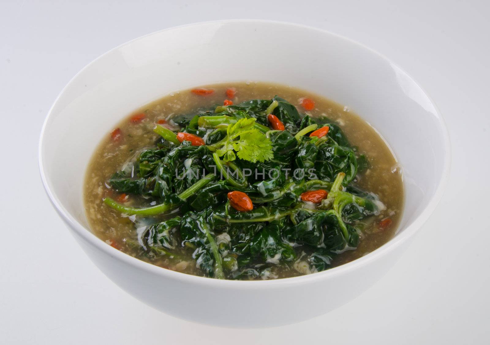 Vegetable soup on isolated white