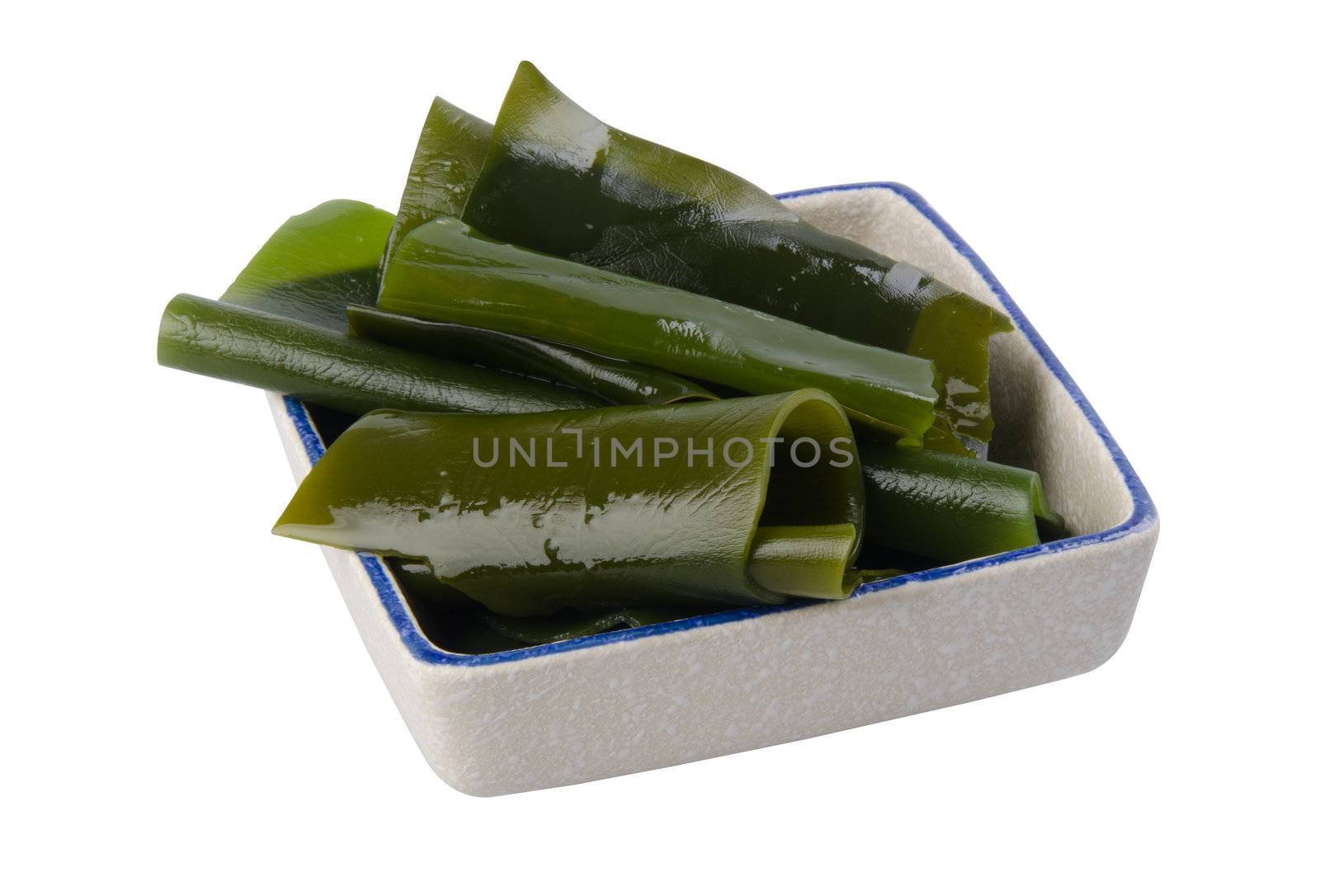 seaweed. Edible seaweed salad on white background Close-up by heinteh