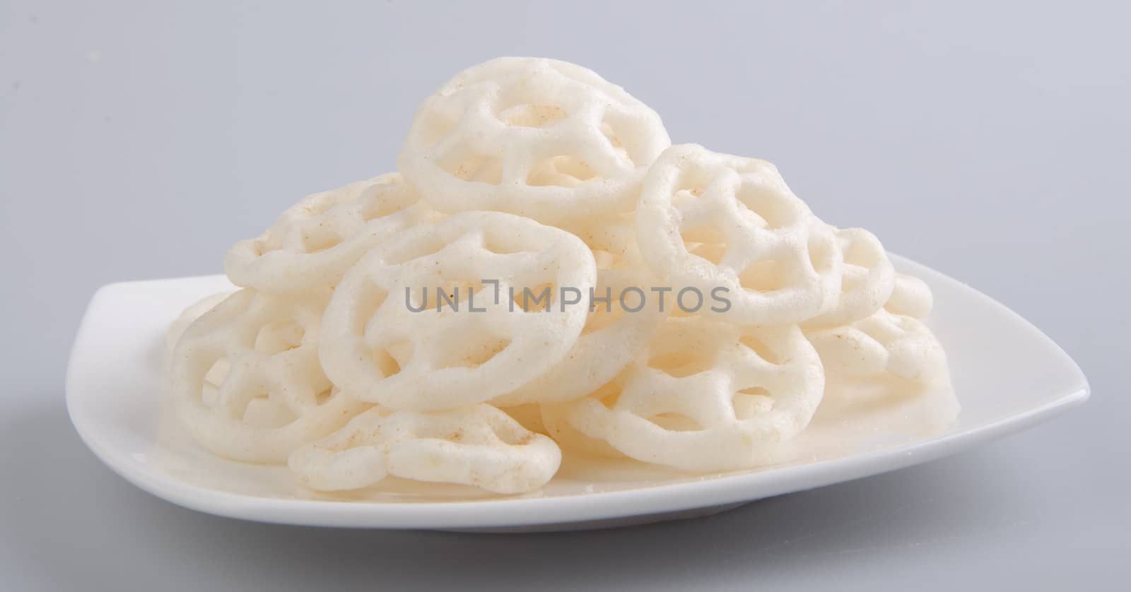 Junk food, potato ring on a background