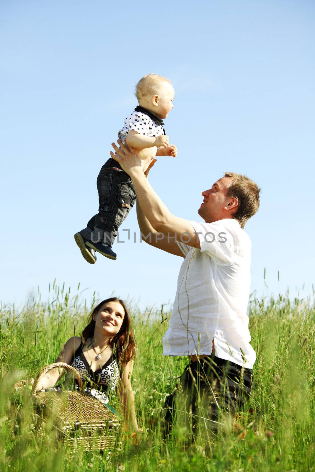 happy family in green grass