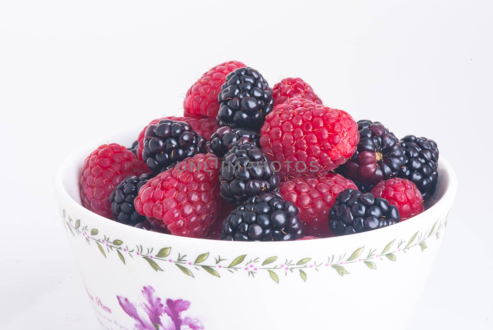 raspberry and blackberry on white isolated background