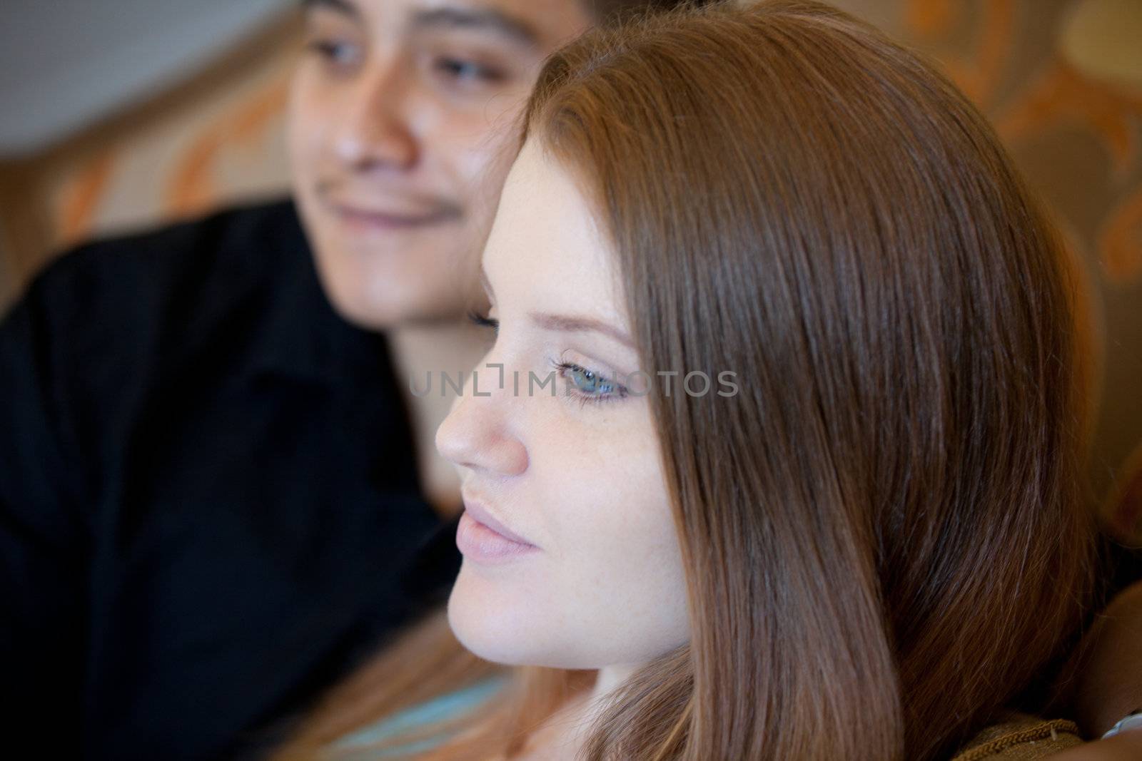 Couple in thought after conversation shot inside