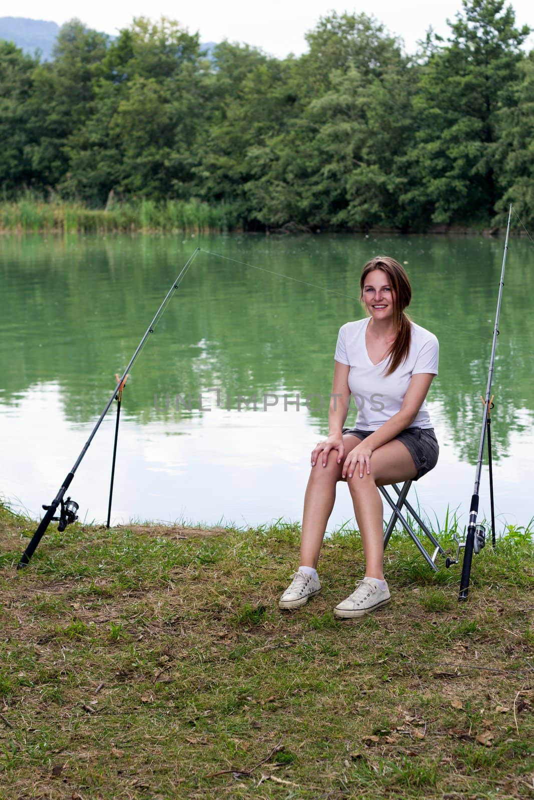 Woman Fishing at a lake by dwaschnig_photo