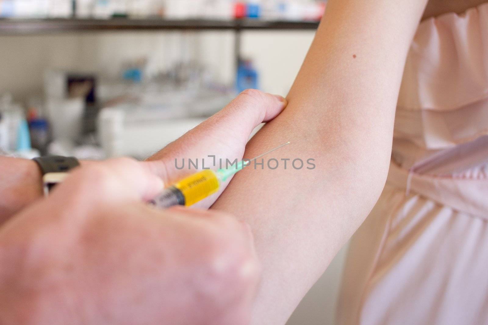 Woman getting a vaccination in the arm