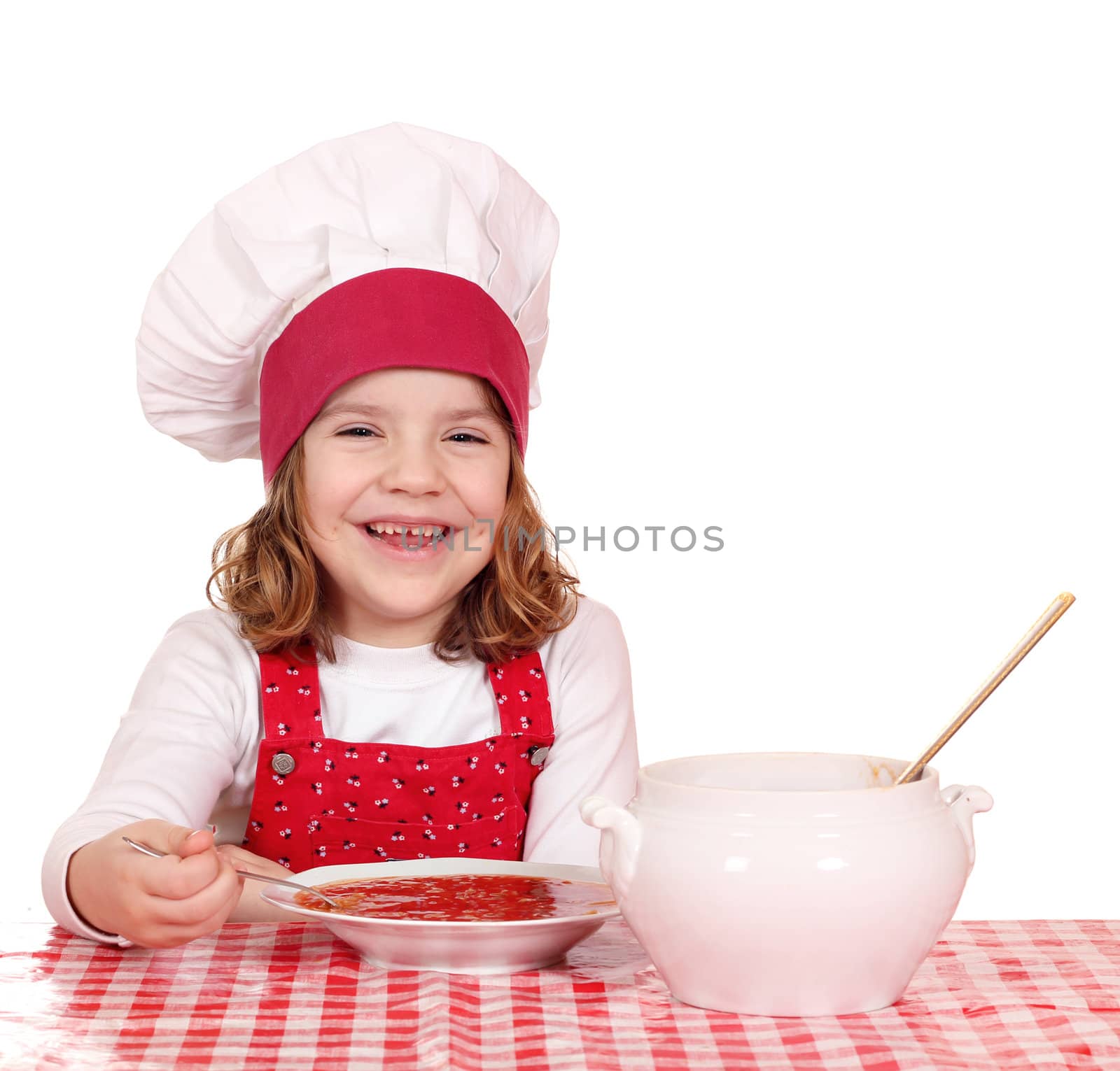 happy little girl cook eat soup by goce