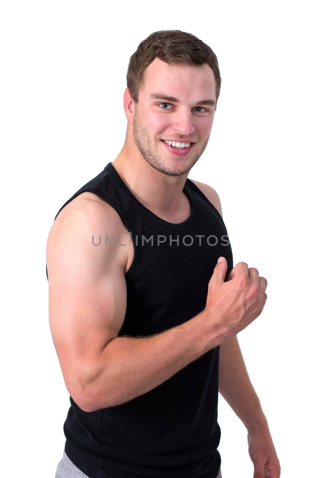 Young attractive man flexing his biceps and smiling