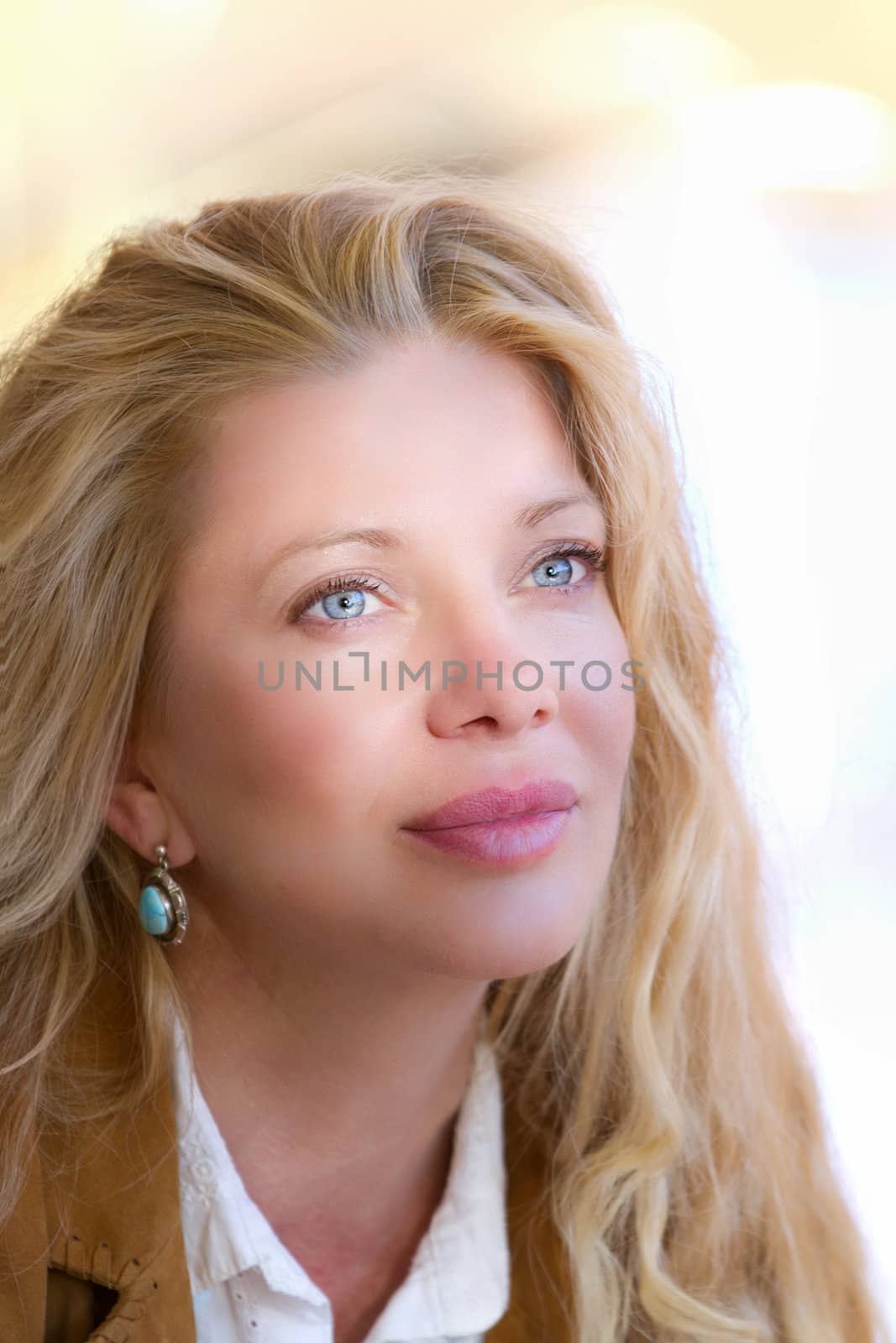 Pretty Woman with Long Hair in fall leaves