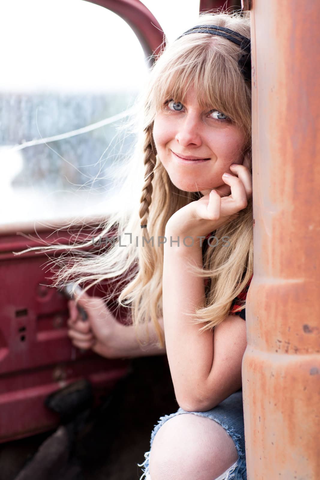 Pretty Blonde Girl in a Vintage old truck