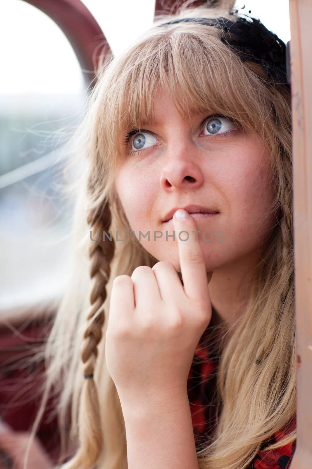 Pretty Blonde Girl in a Vintage old truck in thought