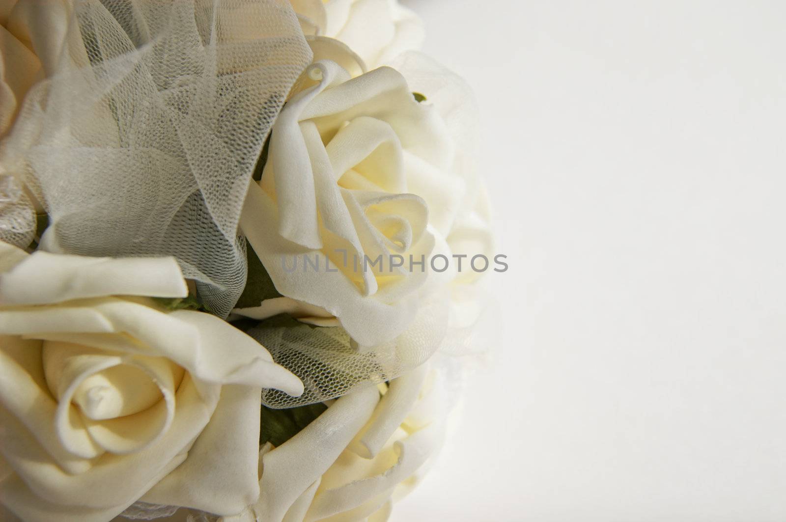 Wedding decoration - white roses bouquet, rings, bride and groom