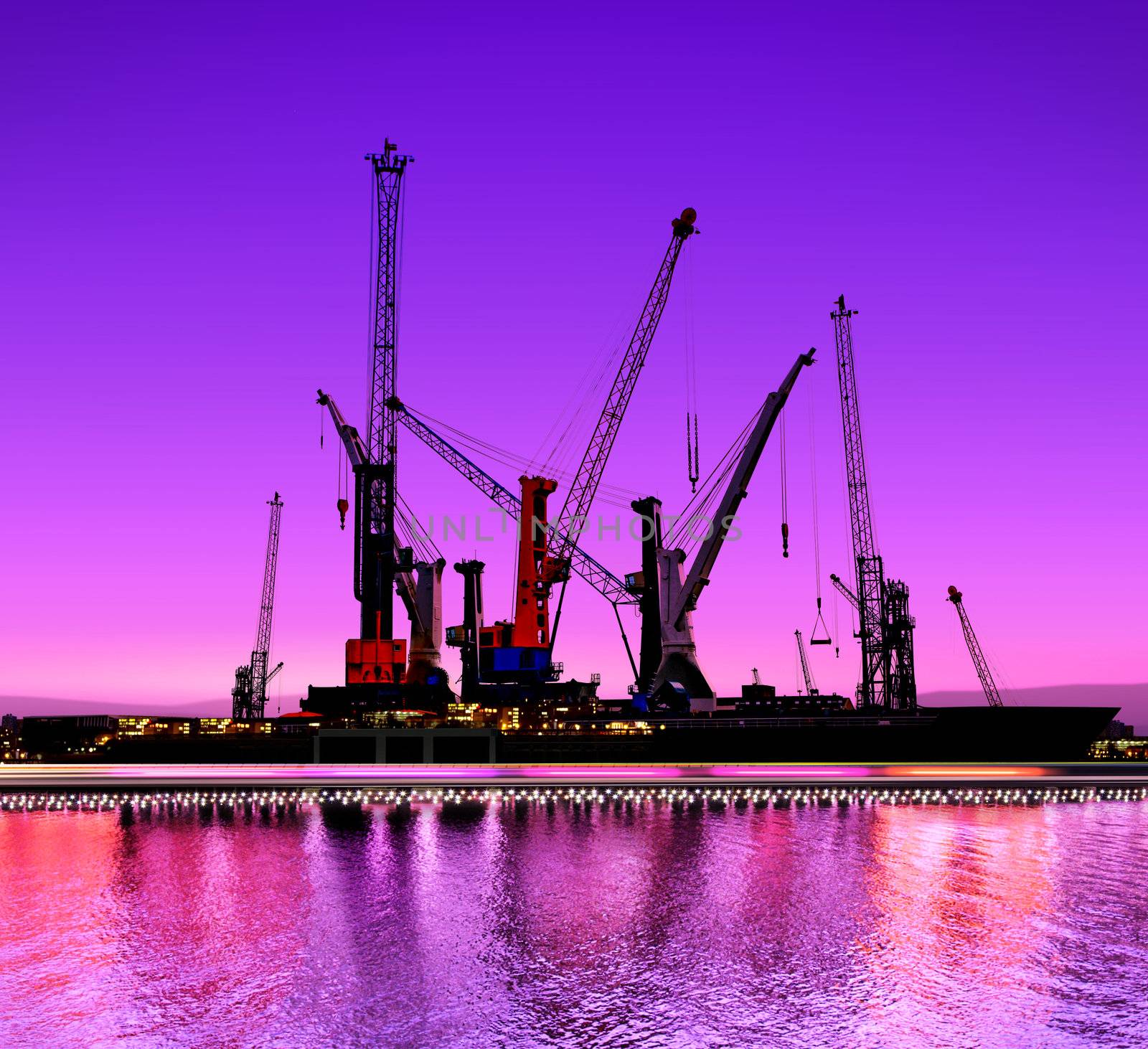urban night view of the shipyards with cranes