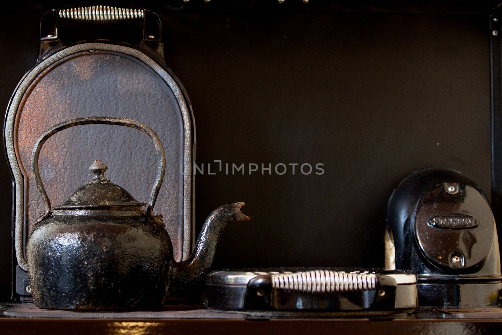 Old kettle on the stove by michalpecek
