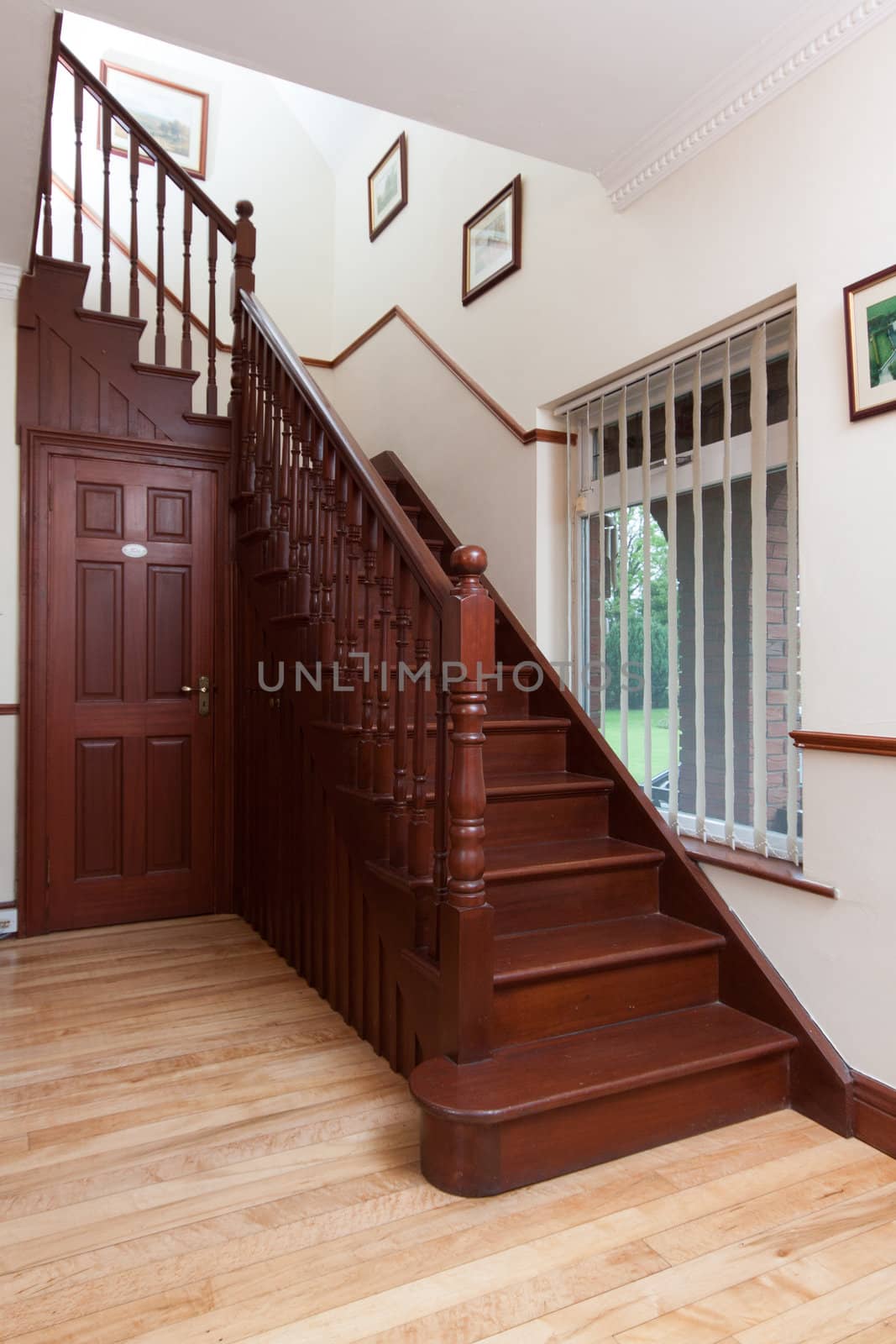 Dark brown wooden staircase in a family house