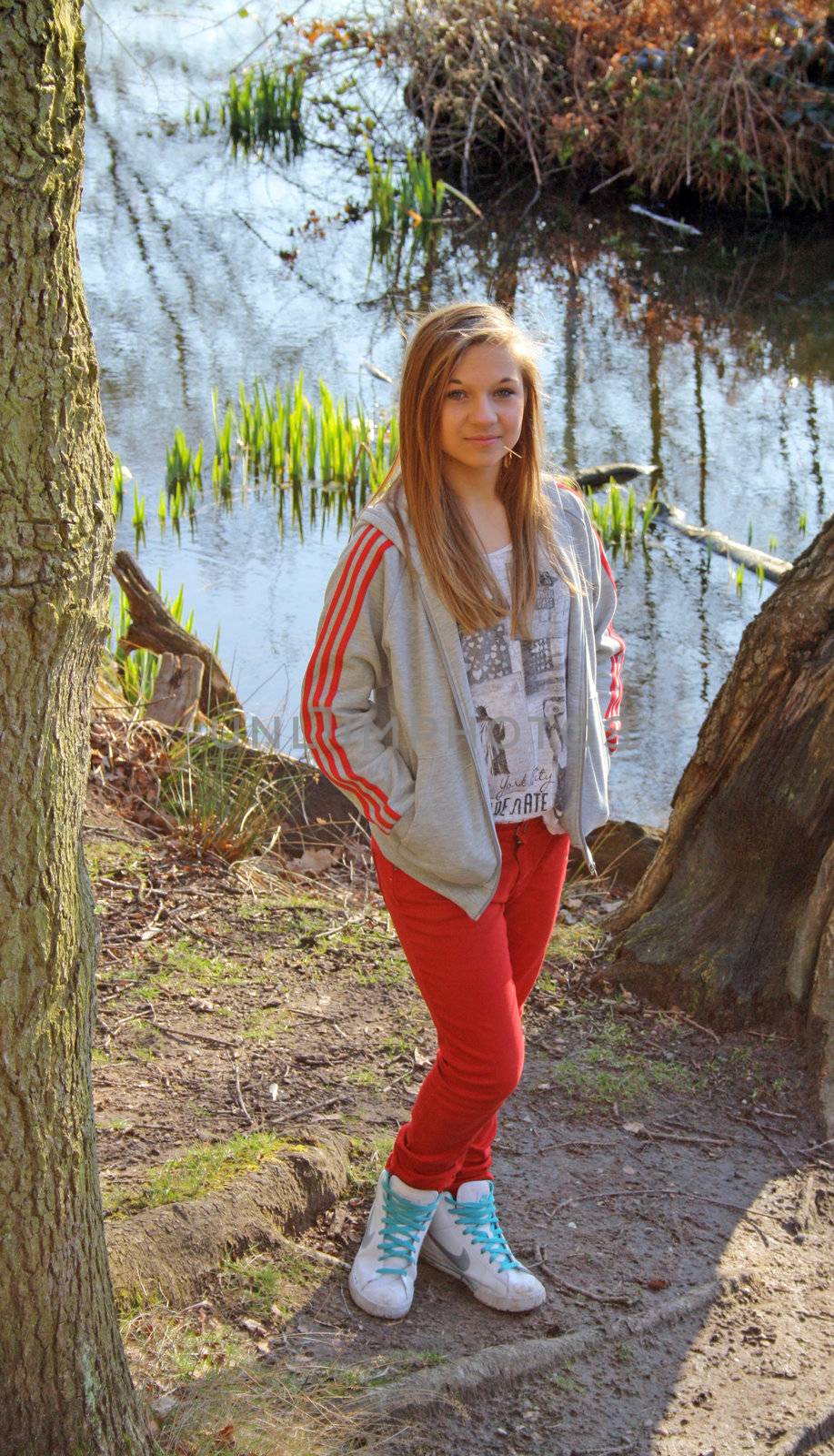 teenage girl in the woods by lizapixels