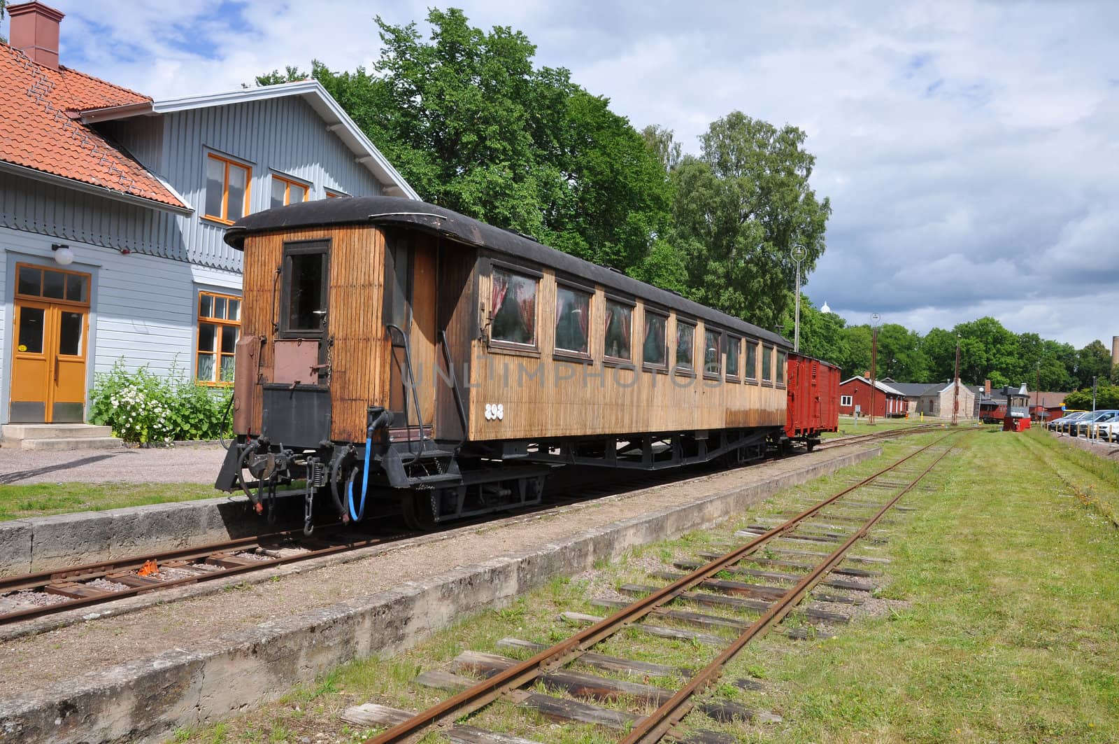 Old passenger train or rail car at station in Sweden