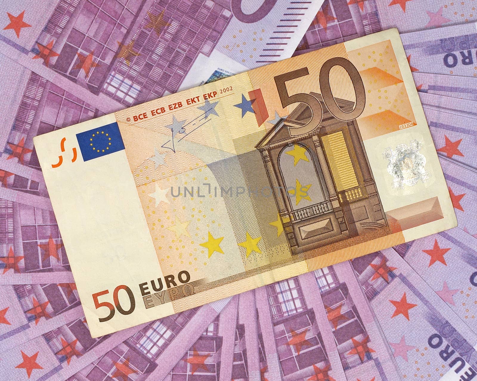 Euro banknotes as background.