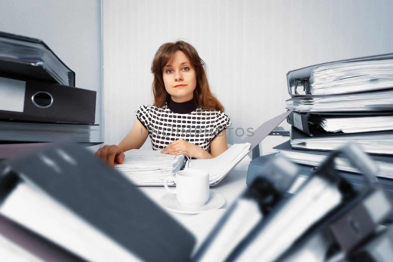 Business woman working in office with documents by pzaxe