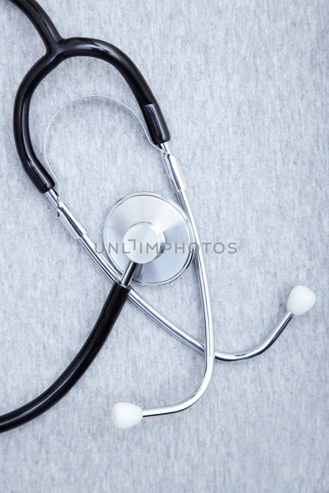 Medical stethoscope on a textured background. Close-up photo