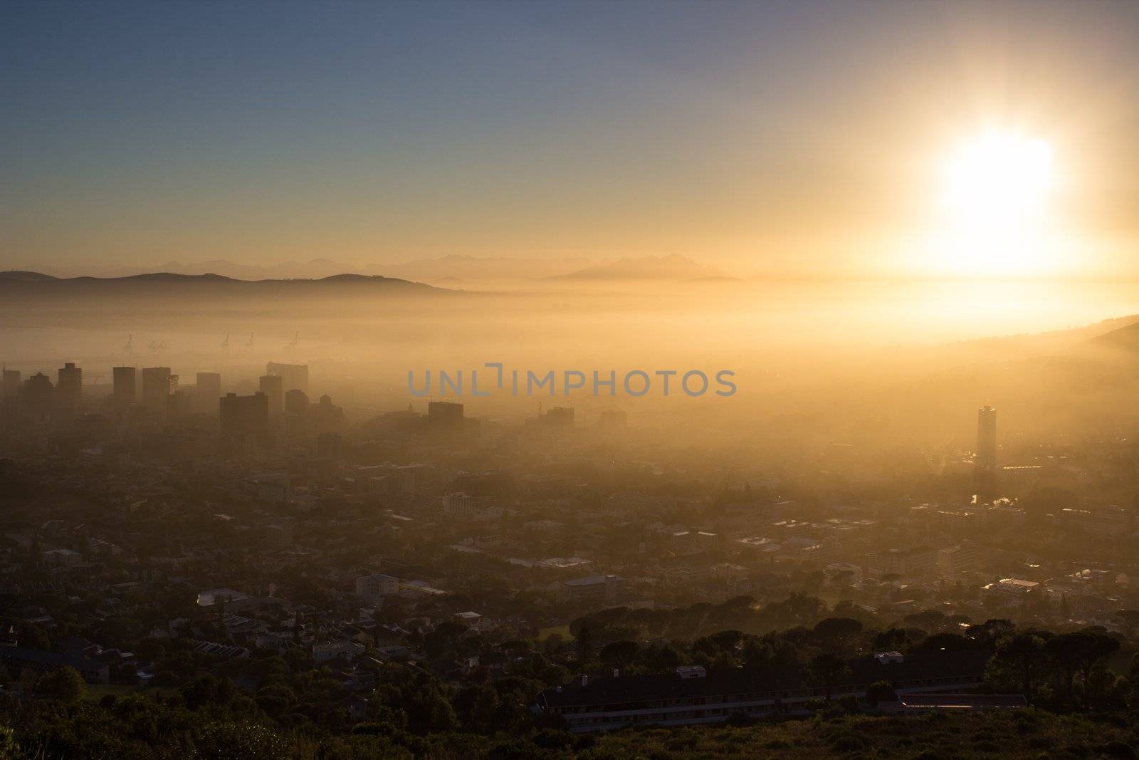 Photo Of Cape Town On A Misty Morning With Buildings Looking Through The Fog