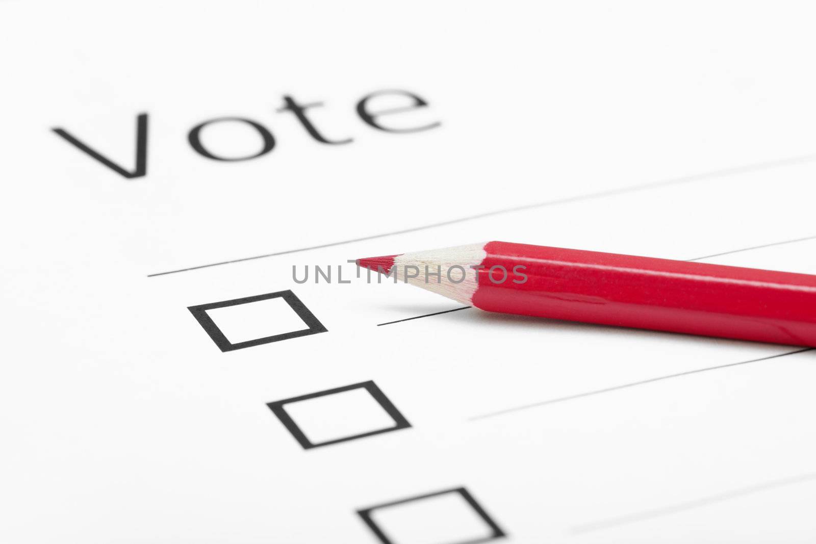 Voting bulletin with red pencil. Close-up photo with shallow depth of field