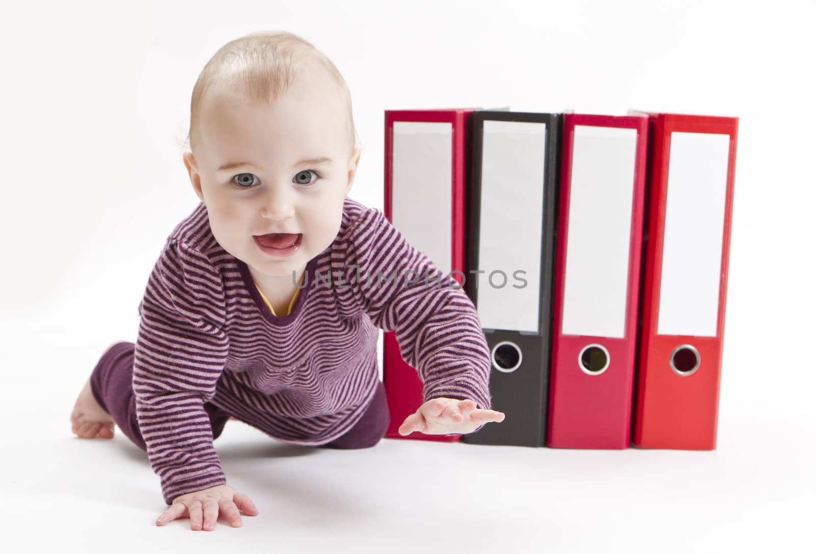 young child in light background with four ring files